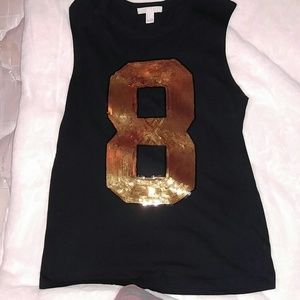 Med size black and gold tee